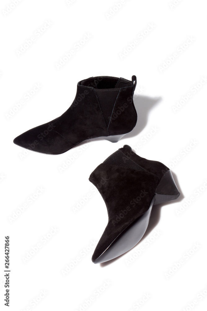 Total black soft suede leather kitten heel ankle boots Stock Photo