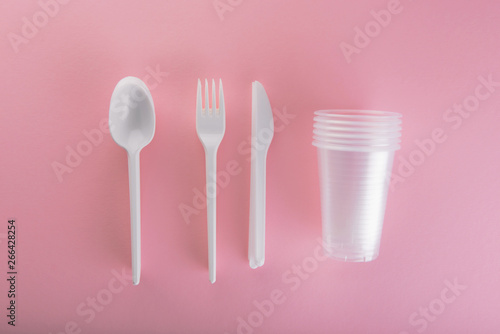 Plastic utensils  Forks  spoons  knives. Picnic dishes. not eco-friendly plastic. Environmental protection.