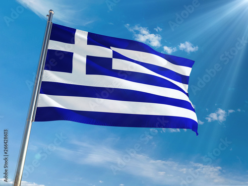 Greece National Flag Waving on pole against sunny blue sky background. High Definition