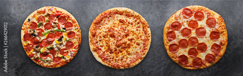 three different pizzas in panoramic composition