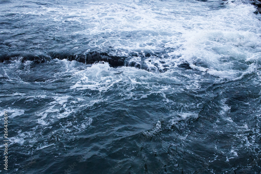 Dark blue nothern ocean waves in winter. Water surface Dark blue nothern ocean waves in winter. Water surface