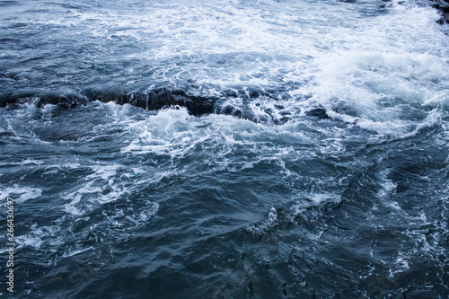 Dark blue nothern ocean waves in winter. Water surface