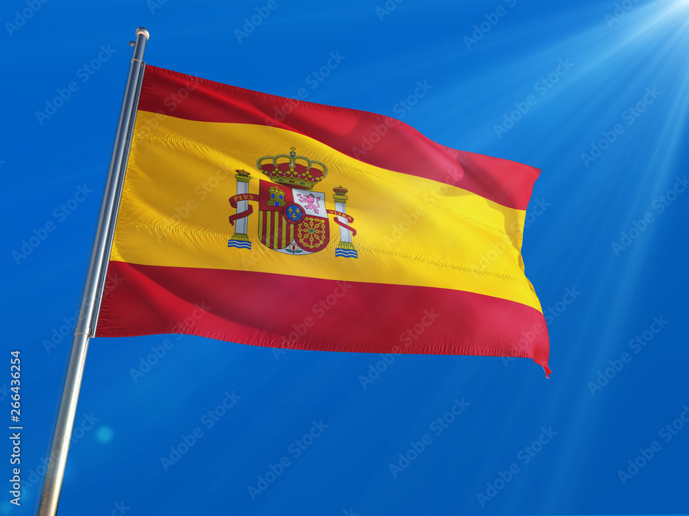 Spain National Flag Waving on pole against deep blue sky background. High Definition Spain National Flag Waving on pole against deep blue sky background. High Definition