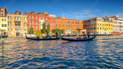 Gondolas in silhouette on the Grand Canal in Venice  Italy  faces blurred for commercial use