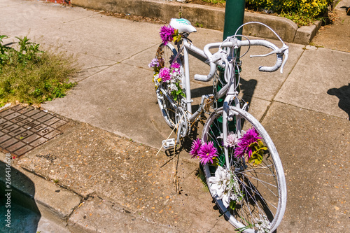 Flowery Bicycle Decoration Attached to Street Sign