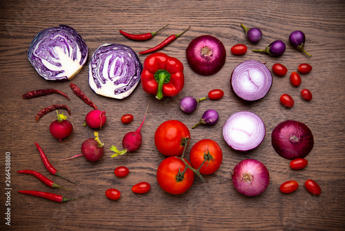 red vegetables set on woode...