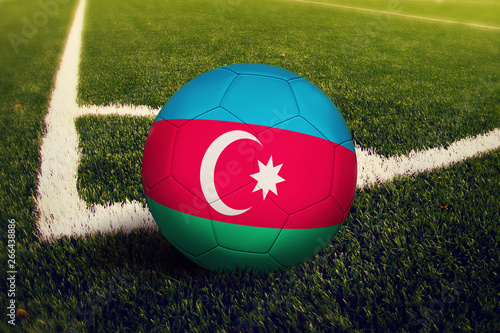 Azerbaijan ball on corner kick position  soccer field background. National football theme on green grass.