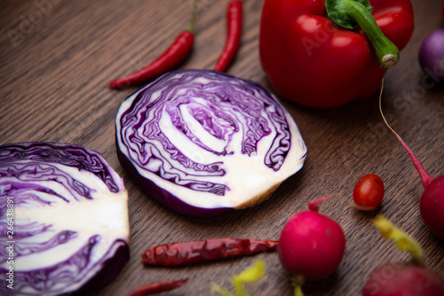 red vegetables set on woode...