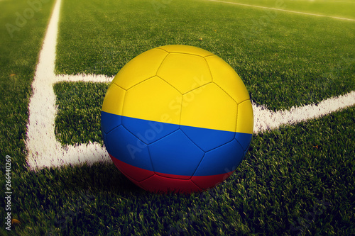 Colombia ball on corner kick position  soccer field background. National football theme on green grass.