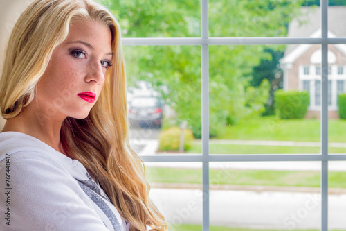 Free Download Pretty blonde girl in front of window  - GFXLoad