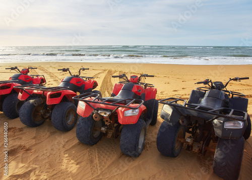 Several ATVs on the beach