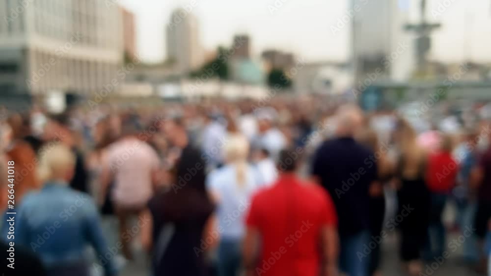 4k out of focus video of big crowd of people walking on street at evening 4k out of focus video of big crowd of people walking on street at evening