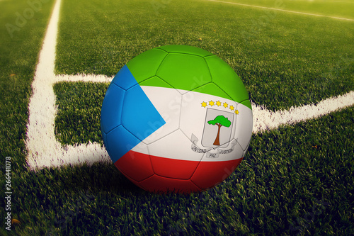 Equatorial Guinea ball on corner kick position  soccer field background. National football theme on green grass.