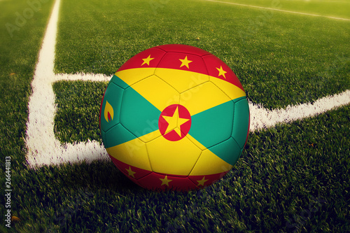 Grenada ball on corner kick position  soccer field background. National football theme on green grass.
