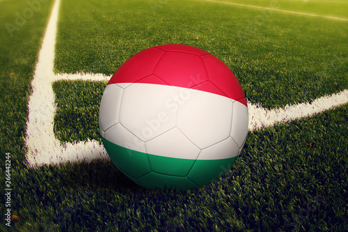 Hungary ball on corner kick position  soccer field background. National football theme on green grass.