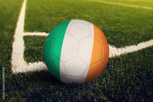 Ireland ball on corner kick position  soccer field background. National football theme on green grass.