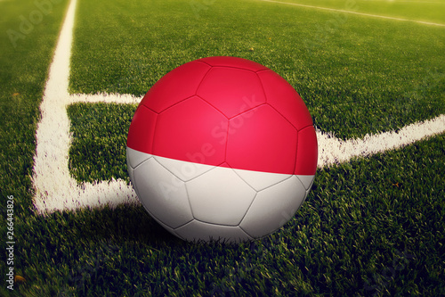 Monaco ball on corner kick position  soccer field background. National football theme on green grass.