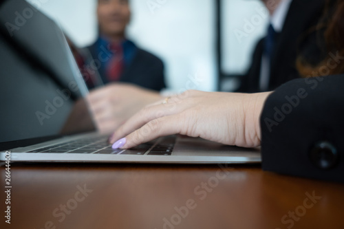 young businesswoman working with mobile laptop and documents in office, business concept