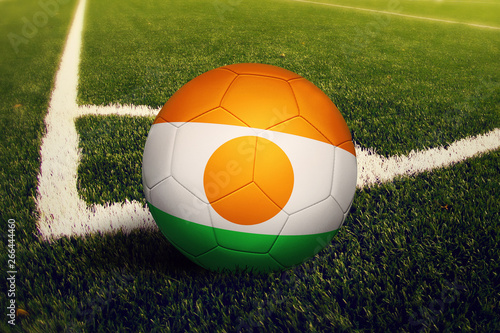 Niger ball on corner kick position  soccer field background. National football theme on green grass.