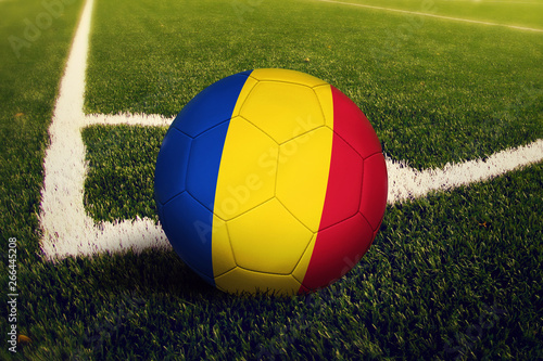 Romania ball on corner kick position  soccer field background. National football theme on green grass.