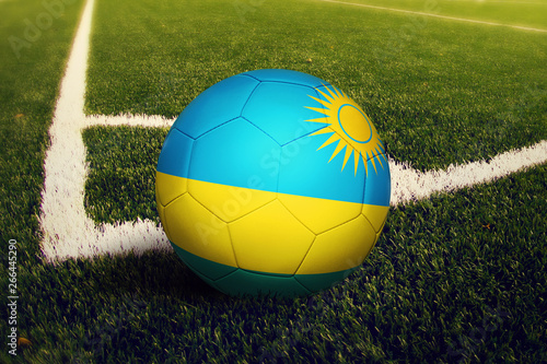 Rwanda ball on corner kick position  soccer field background. National football theme on green grass.