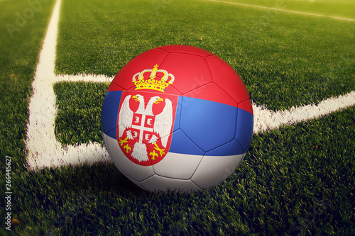 Serbia ball on corner kick position  soccer field background. National football theme on green grass.
