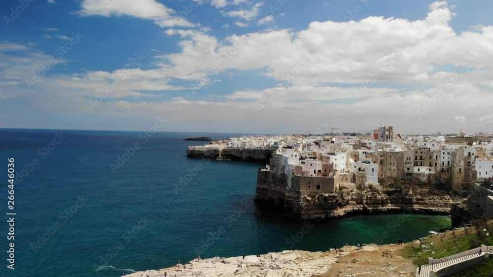 Aerial rise revealing the beautiful coast of the romantic town Polignano a Mare in Puglia, Italy Aerial rise revealing the beautiful coast of the romantic town Polignano a Mare in Puglia, Italy