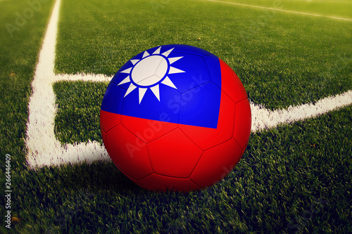Taiwan ball on corner kick position  soccer field background. National football theme on green grass.