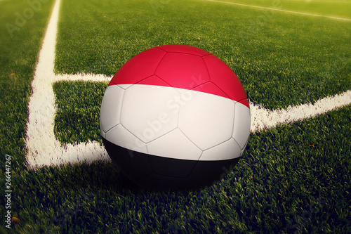 Yemen ball on corner kick position  soccer field background. National football theme on green grass.