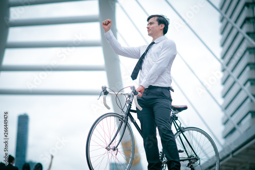 Young business man good healthy on bicycle. 