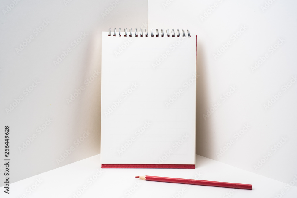 red spiral notebook with white page on 3D space red spiral notebook with white page on 3D space