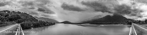 A dramatic view of North Patagonia landscapes, bad autumn weather with an overcast and stormy day full of clouds bringing rain to the amazing scenery. An awe road trip around Reloncavi estuary 