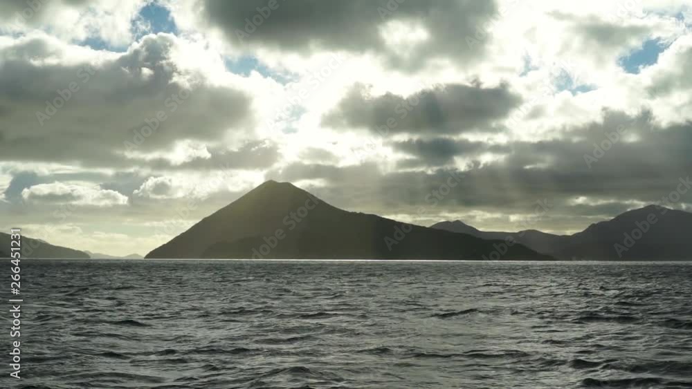SLOWMO - Morning view of sun, sky, clouds, hills and ocean from boat in Marlborough Sounds, New Zealand SLOWMO - Morning view of sun, sky, clouds, hills and ocean from boat in Marlborough Sounds, New Zealand