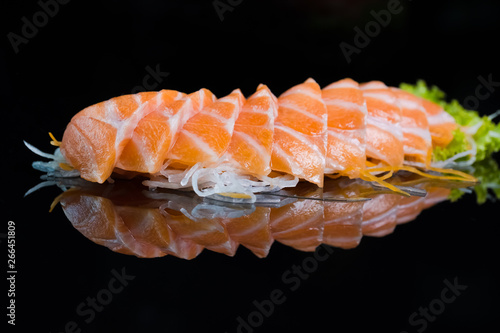 Salmon Sashimi on Black Ceramic Plat,black background.
