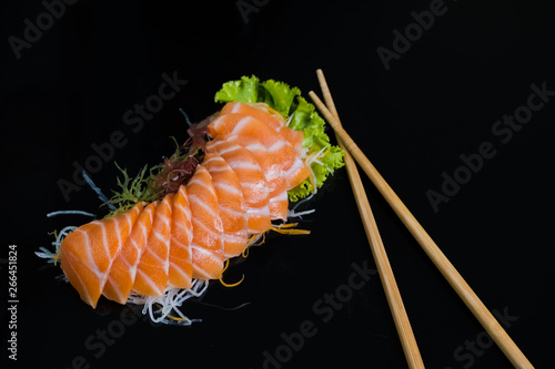 Salmon Sashimi on Black Ceramic Plat,black background.