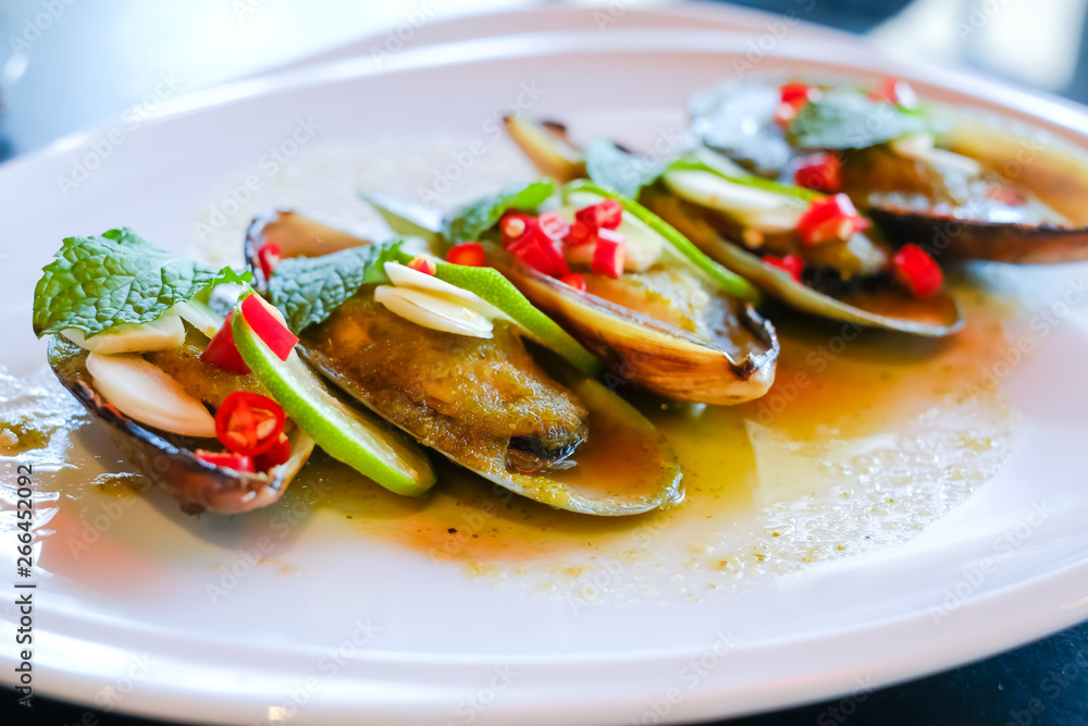 Mussels toping galic and lemon, fusion food