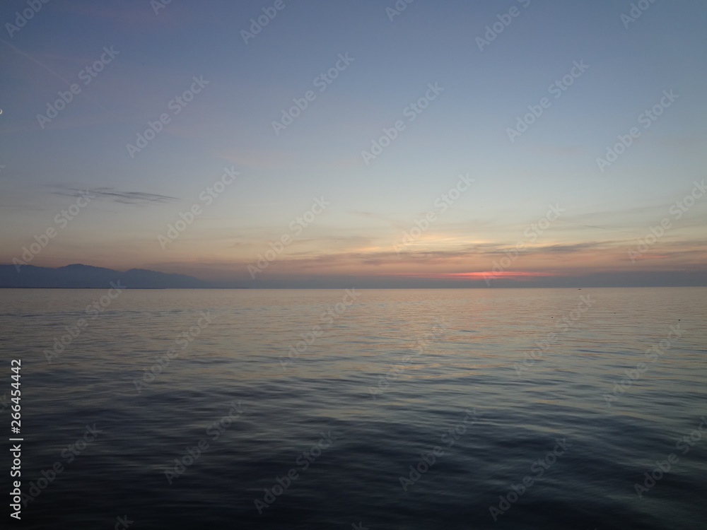 Scenic view on rippling water on lake at sunset