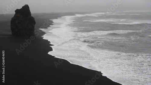 Slow waves on the beach at Reynisfjara, Iceland. photo