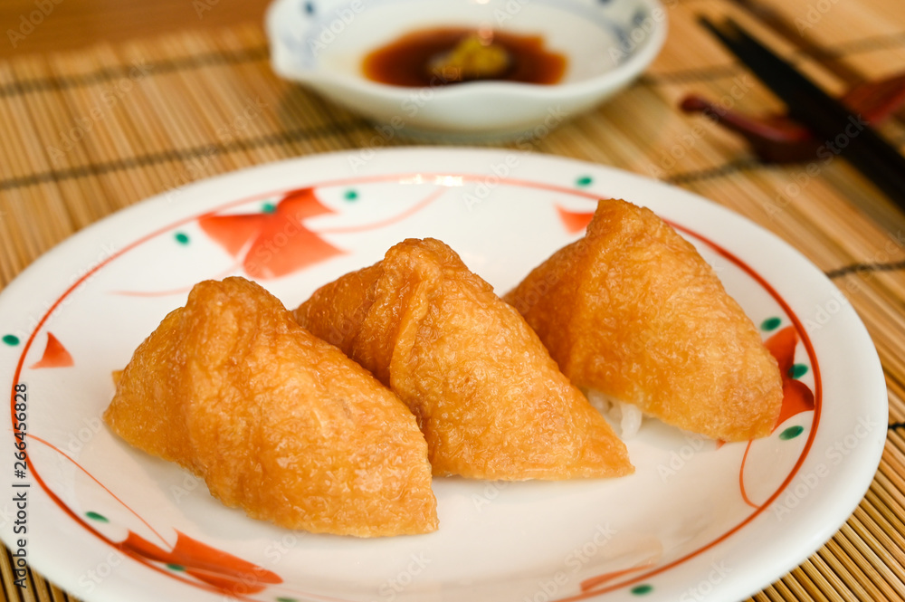 Inari sushi, deep fried tofu filled with rice (Japanese food) Inari sushi, deep fried tofu filled with rice (Japanese food)