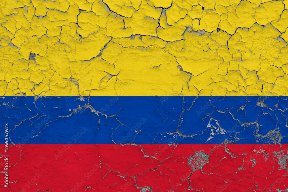 Flag of Colombia painted on cracked dirty wall. National pattern on vintage style surface.