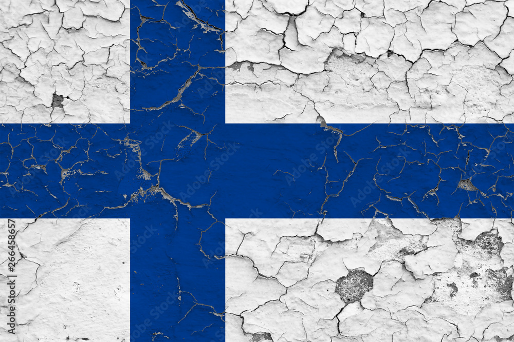 Flag of Finland painted on cracked dirty wall. National pattern on vintage style surface.