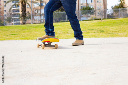 young skateboarder legs riding skateboard at skatepark. © Victoria Key