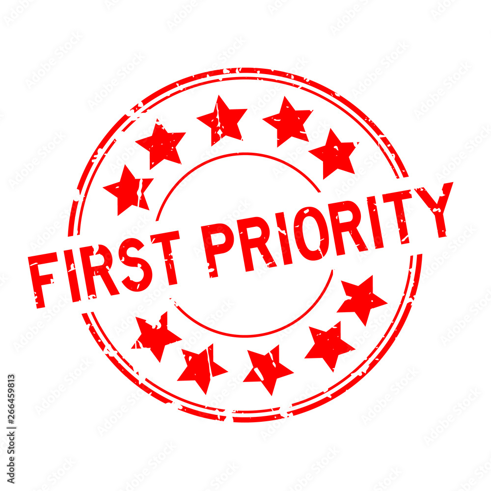 Grunge red first priority word with star icon round rubber seal stamp on white background Grunge red first priority word with star icon round rubber seal stamp on white background