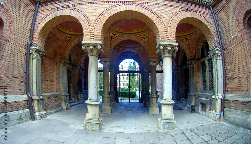 arched brick entrance and corridor with columns