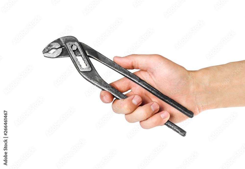 Hand holds a large pair of tongs. Close up. Isolated on white background Hand holds a large pair of tongs. Close up. Isolated on white background