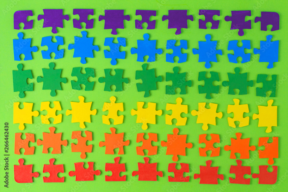 equality promotion: set of puzzle colors of the LGBT flag on a green background equality promotion: set of puzzle colors of the LGBT flag on a green background