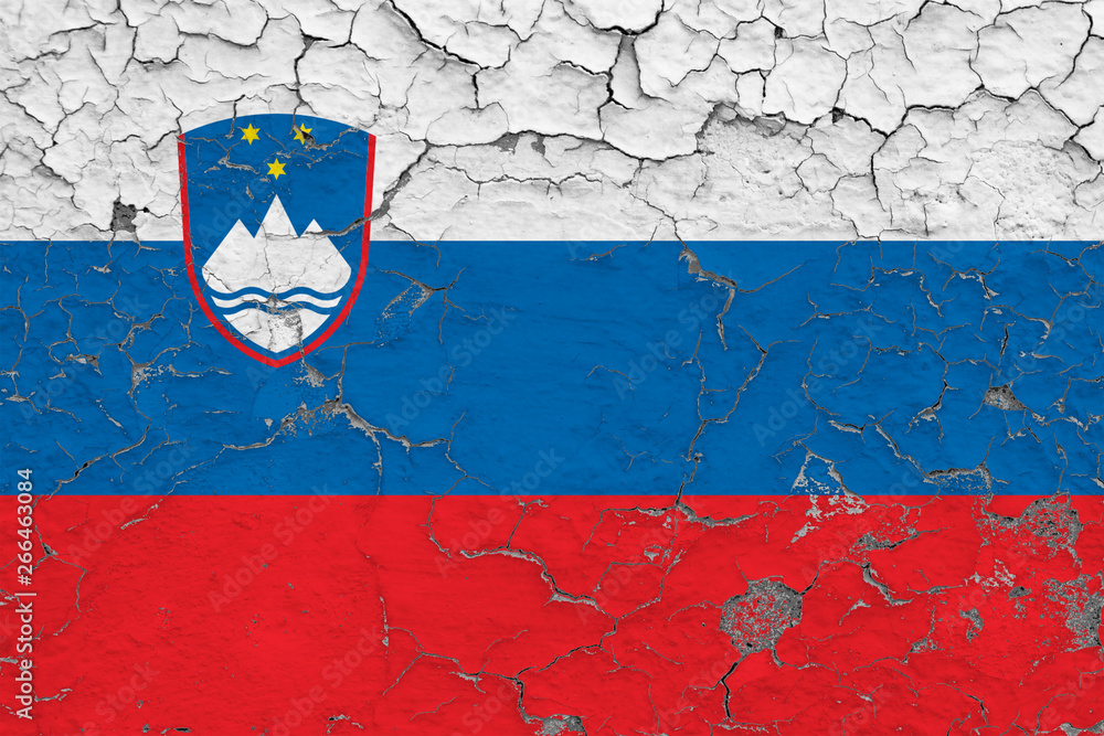 Flag of Slovenia painted on cracked dirty wall. National pattern on vintage style surface. Flag of Slovenia painted on cracked dirty wall. National pattern on vintage style surface.