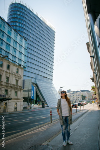 young woman walking on the street © NatBud