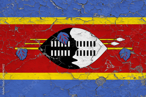 Flag of Swaziland painted on cracked dirty wall. National pattern on vintage style surface.