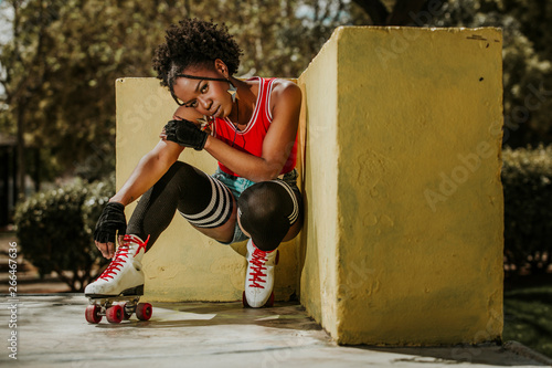 Photos Beautiful black woman posing on roller skates
